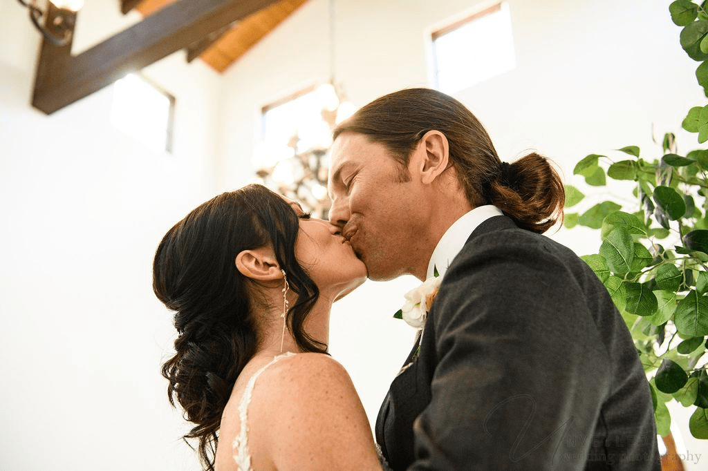 Choosing between Candid vs Posed Photography comes down to the style of memories you want from your big day. Candid photography captures authentic, spontaneous moments, from laughter and joyful tears to little gestures you might not even notice. Posed photography, on the other hand, ensures timeless, structured portraits, perfect for family formals and couple shots that look elegant for years to come.
Most modern couples choose a balanced mix, often around 70% candid and 30% posed, so they get the best of both worlds. This approach lets you relive genuine emotions while also preserving classic, polished memories that are perfect for albums, frames, and sharing with loved ones. Understanding these styles helps you decide what wedding photography style suits your personality and wedding day vision best.
What Is Candid Wedding Photography?

Candid wedding photography is all about capturing the day as it naturally unfolds. Photographers focus on real-life moments without posing, which results in emotional, genuine photos.
Natural and Unscripted Moments
Candid photography captures real laughter, emotional tears, and subtle gestures that often go unnoticed. For example, a groom sneaking a kiss before the ceremony or a friend making a funny face during speeches can create unforgettable images.
The key is to blend into the background so the couple and guests feel comfortable and can enjoy the moment without interruptions.
Best Moments for Candid Photography
Candid shots shine during:
Emotional moments during the ceremony
Family and guest reactions
Dancing, laughter, and playful interactions at the reception
Private, intimate moments between the couple
These photos are not just pictures; they are memories that tell the story of your wedding day in a raw and authentic way.
Pros and Cons of Candid Wedding Photography
Pros:
Captures genuine, heartfelt emotions
Feels relaxed and natural
Tells a complete story of the day
Cons:
Some fleeting moments might be missed
Requires a highly skilled photographer to capture quality shots in natural light
Less control over the exact composition and poses
Candid photography is ideal for couples who want their wedding photos to feel authentic, emotional, and story-driven.
What Is Posed Wedding Photography?

Posed wedding photography is structured and traditional. The photographer directs the couple, bridal party, and families to achieve polished, frame-worthy shots.
Structured and Traditional Style
In posed photography, the photographer decides where people stand, how they hold themselves, and how to arrange the group. This ensures every key person is captured in a clear, elegant, and timeless image.
Best Moments for Posed Photography
Posed photography works best for:
Family portraits
Bridal party photos
Couple portraits in iconic locations
Important group shots, like grandparents or special friends
These photos are usually displayed in albums, framed on walls, or shared with family. They preserve classic memories that last for generations.
Pros and Cons of Posed Wedding Photography
Pros:
Ensures no one important is missed
Clean, polished, and elegant images
Great for framing and albums
Cons:
Can feel stiff or unnatural if overdone
Takes time away from candid celebrations
Less emotional spontaneity
Posed photography is perfect for couples who value timeless, formal, and organized images that capture key people and moments.
Candid vs Posed Photography: Key Differences

Understanding these differences helps couples decide what suits them best.
Emotion vs Perfection: Candid focuses on real emotions; posed focuses on perfect composition.
Flexibility vs Control: Candid photography is flexible and spontaneous, while posed photography is controlled and planned.
Storytelling vs Formal Memories: Candid tells the story of the day; posed preserves important family moments and formal portraits.
Most couples find that combining both styles ensures their wedding album has both heartfelt storytelling and elegant, timeless photos.
The Hybrid Approach: Best of Both Worlds

Today, the most popular trend is a hybrid approach, which mixes candid and posed photography.
Why Most Couples Choose a Mix?
A common choice for couples getting married in San Diego and all over the world is 70% candid and 30% posed,  capturing natural moments while still making time for structured family and couple portraits. This approach balances spontaneity and perfection, giving couples the best of both worlds.
How a Hybrid Style Improves Your Wedding Album?
With a hybrid style, your wedding album includes:
Real, emotional moments that tell the story of your day
Timeless couple and family portraits that everyone will treasure
Images that feel natural yet polished, ensuring your memories look amazing for decades
This approach is highly recommended because it captures both the energy of the celebration and the formality of family traditions.
How to Choose the Right Photography Style for Your Wedding?

Consider Your Personality
Think about how you feel in front of a camera. If you feel shy, candid shots may be more comfortable. If you enjoy posing, structured photography could suit you better. Also, think aboutyour wedding day timeline.
Relaxed timelines allow more candid moments
Tight schedules benefit from pre-planned posed sessions
Long-Term Memories
Ask yourself: Which photos will I love looking back on 10 or 20 years from now? Most couples value both authenticity and timeless formality, making a hybrid style ideal.
Choosing the Right Wedding Photographer in San Diego

Finding the right photographer is just as important as choosing between candid and posed styles. A skilled photographer can capture both authentic moments and classic portraits, creating a wedding album that tells your full story.
Review Full Wedding Galleries
Don’t just look at highlight reels. Browse complete wedding galleriesand see real client reviews to see how the photographer handles different moments throughout the day. This helps you understand how well they balance candid and posed shots in real wedding scenarios.
Ask About Their Shooting Style
 Photographers often have a natural style; some lean toward candid, photojournalistic storytelling, while others focus on structured, formal images. Make sure their approach aligns with your vision and the type of memories you want to preserve.
Clear Communication Is Key
 Discuss your preferences, timeline, and must-have moments well before the wedding day. Clear communication ensures your expectations are understood, your priorities are captured, and the day flows smoothly without unnecessary interruptions.
Best San Diego Wedding Photographers
San Diego is home to talented photographers who specialize in capturing the perfect mix of candid and posed moments. Unveiled Wedding connects couples with the best san deigo wedding photographers who understand the local venues, lighting, and coastal backdrops unique to San Diego. Choosing a photographer familiar with the area ensures you get stunning, personalized images that reflect both your style and the beauty of your surroundings.
Common Mistakes Couples Make

Even the most organized couples can make simple mistakes when planning wedding photography. Being aware of common pitfalls helps ensure your big day is captured perfectly.
Not setting a clear budget for photography


Choosing a photographer without checking full wedding galleries


Following trends blindly instead of personal preference


Not discussing style or shot list with the photographer


Underestimating the time needed for posed photos


Ignoring the importance of lighting and venue for photos


Waiting too long to book a professional photographer


Avoiding these mistakes ensures a smoother, stress-free wedding day and helps you get beautiful, well-documented memories that last a lifetime.
Conclusion
There’s no right or wrong choice. Candid vs Posed Photography depends on your personality, your priorities, and the type of memories you want. Candid photography captures real-life emotions and storytelling, while posed photography delivers polished, formal portraits. Combining both styles creates a well-rounded wedding album, offering both heartfelt moments and timeless images.
With the right planning, a skilled San Diego photographer, and a mix of candid and posed shots, your wedding album will tell a complete, meaningful story that you can cherish for years. Have questions about photography styles, pricing, or availability? Reach out, and they’ll help you choose the right photography vision for your venue.
FAQs
Q1: What’s the difference between Candid vs Posed Photography?
Candid captures natural, spontaneous moments, while posed is structured and classic for family or couple portraits.
Q2: Can I combine both styles?
Yes! Most couples go for about 70% candid and 30% posed to get authentic memories and polished shots.
Q3: How do I choose the right photographer?
Check full galleries, ask about their style, and make sure it matches your vision for the day.
Q4: Are San Diego photographers familiar with local venues?
Yes, they know the best spots, lighting, and backdrops across San Diego for beautiful results.
Q5: How early should I book a photographer?
Ideally, 8–12 months before your wedding to secure your preferred professional.


