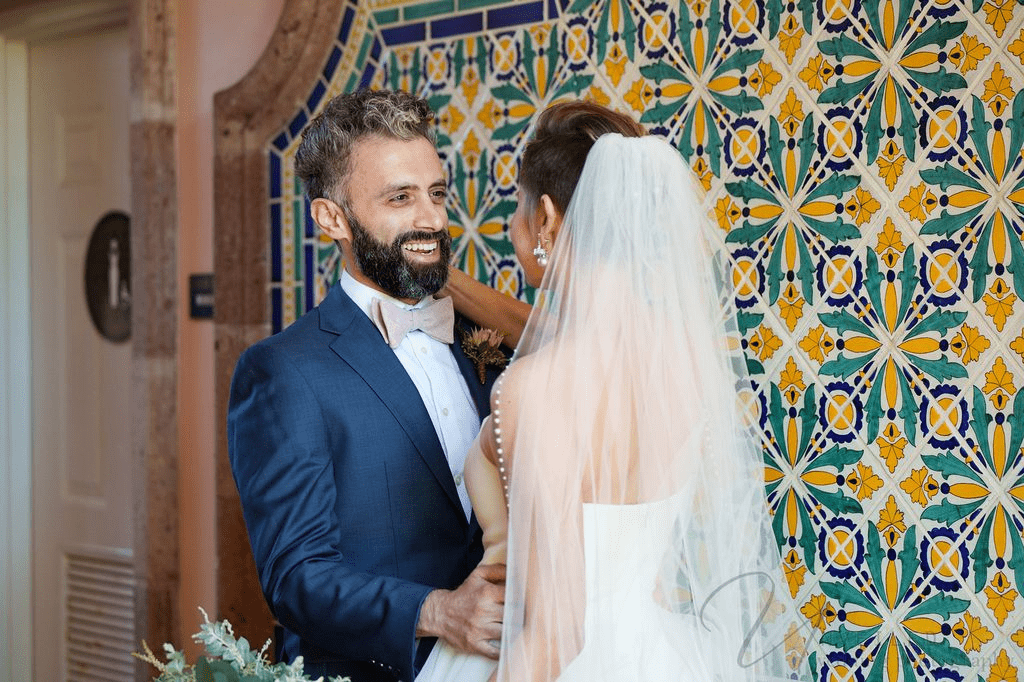 A bride and groom are smiling in this photo by a Second wedding Photographer.