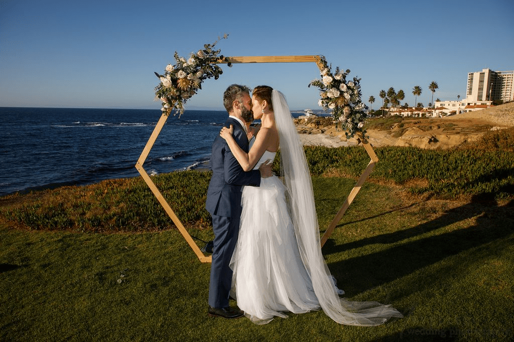 A couple's wedding kiss captured with true-to-life color by a Second wedding Photographer.