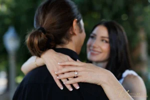 Close-up of diamond ring; check engagement photographer cost San Diego.