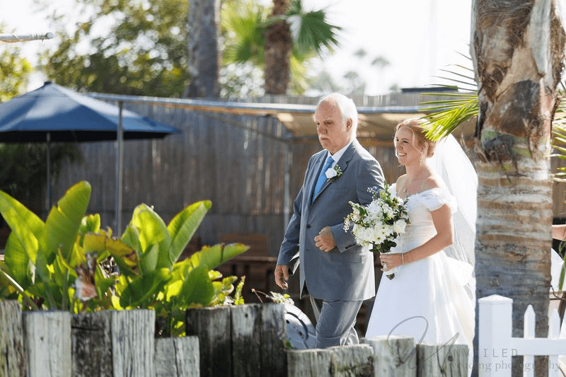 Father walking bride down aisle for Wedding Photography Contract.