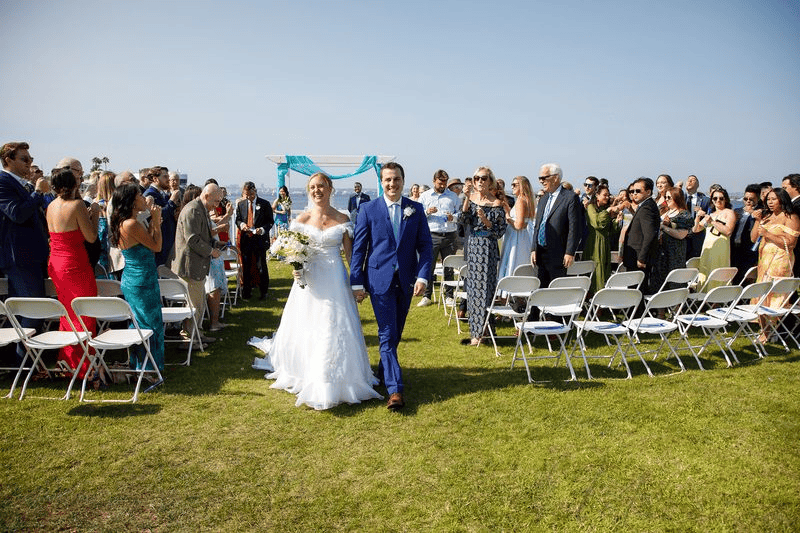 Newlyweds walking down the aisle for Wedding Photography Contract.