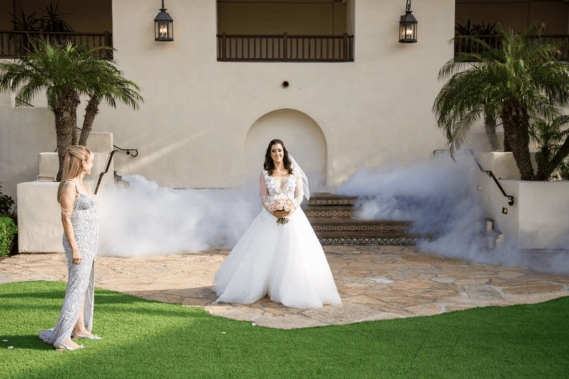 Estancia La Jolla wedding photography featuring a bride in a white gown with a bouquet.