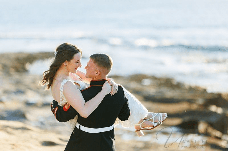 A joyful military wedding portrait captured by Unveiled Wedding photography.