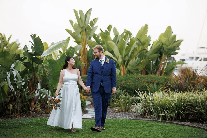 Bride and groom creating candid moments as they pose for wedding photos.