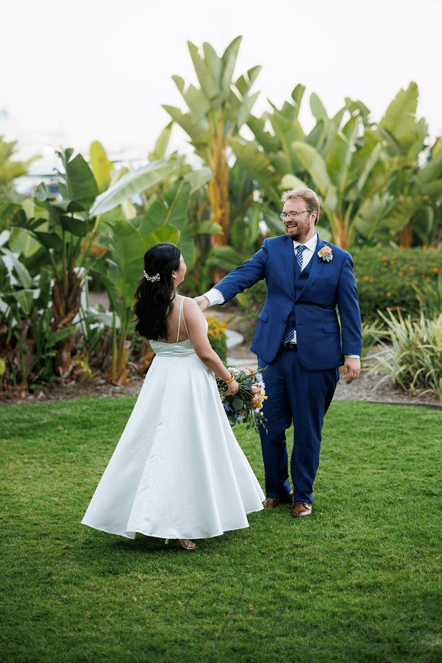 Bride and groom creating candid moments as they pose for wedding photos.
