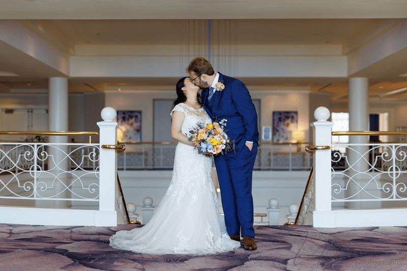 Couple holding each other closely during a pose for wedding photos session