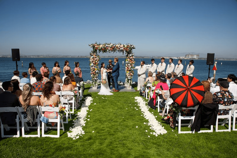 Couple sharing a romantic embrace as they pose for wedding photos outdoors
