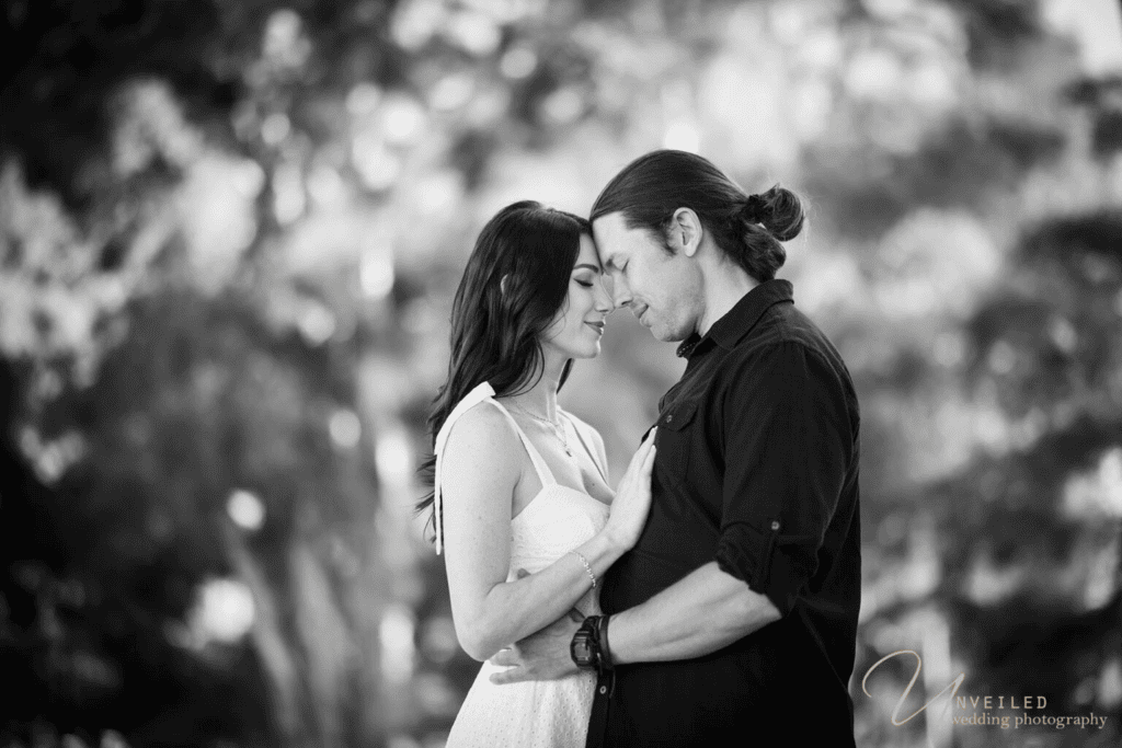 Black & white couple portrait; check engagement photographer cost San Diego.