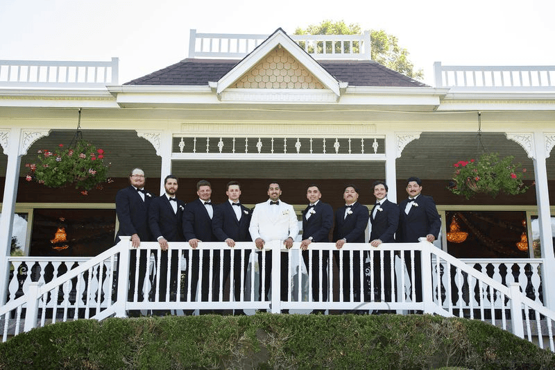 Groom and groomsmen posing at a wedding in Grand Tradition Fallbrook.