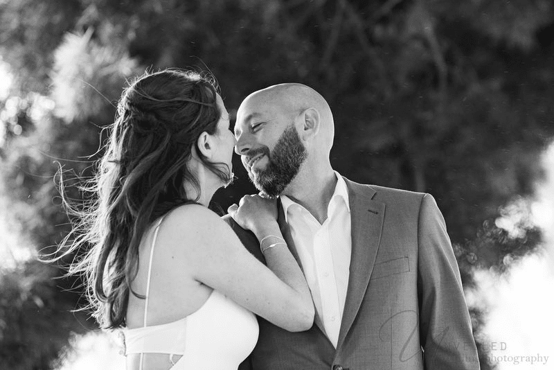 Close-up wedding portrait of newlyweds captured by Unveiled Photography.