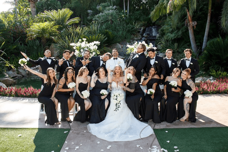 Funny wedding party posing together outdoors at Grand Tradition Fallbrook.