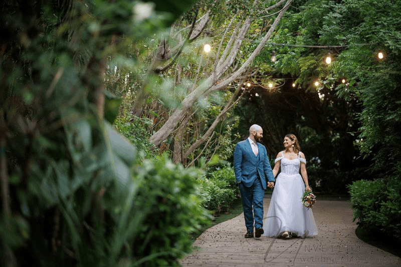 Bride and groom walking together at small wedding venues in San Diego.