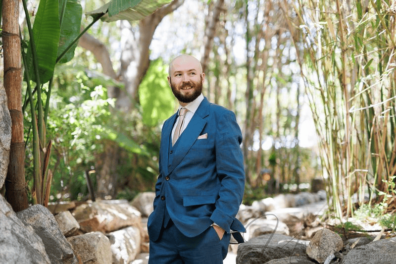 Groom posing in a suit at small wedding venues in San Diego.