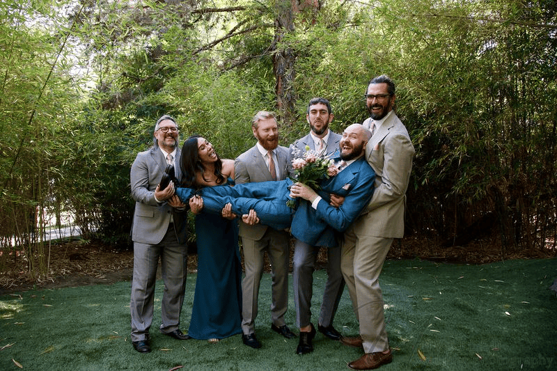 Wedding party holding groom at small wedding venues in San Diego.