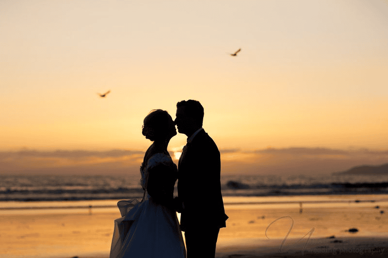 Sunset silhouette photo of couple, essential for a Wedding Photography Shot List.