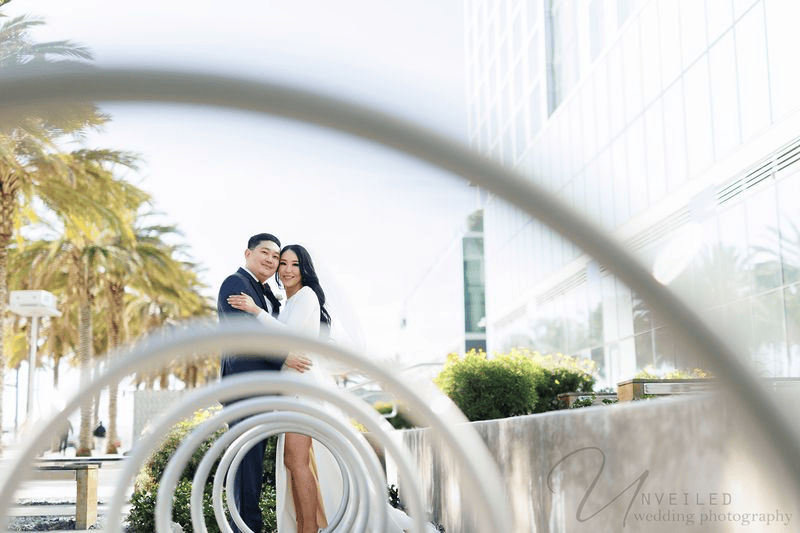 Artistic couple portrait framed by rings for a Wedding Photography Shot List.