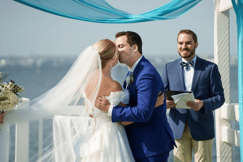 Bride and groom kissing at altar, classic moment for a Wedding Photography Shot List.