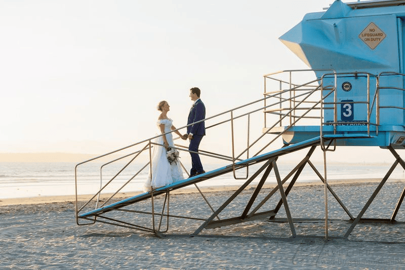 Bride and groom on lifeguard tower ramp for a Wedding Photography Shot List.