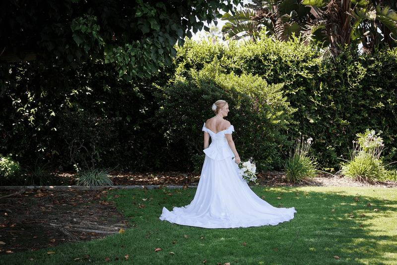 Bride posing in garden, an essential idea for a Wedding Photography Shot List.