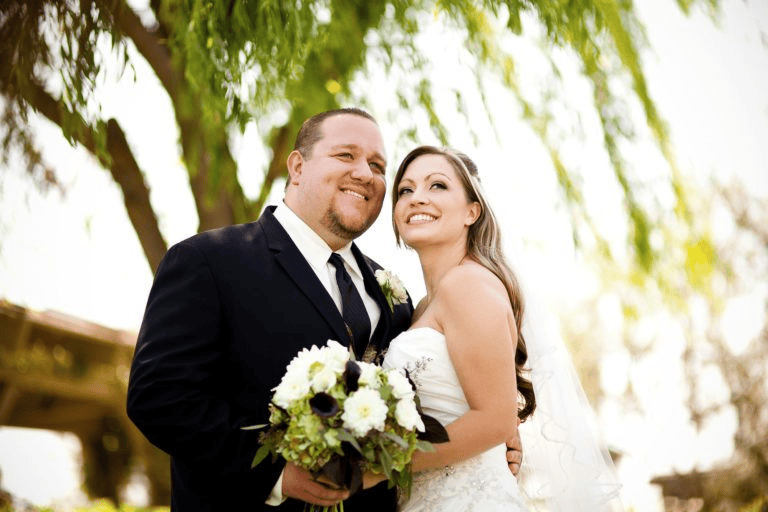 Smiling bride and groom outdoor portrait reflecting Wedding Photography Trends 2027.