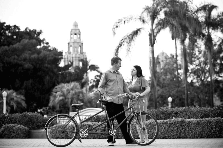 Black and white portrait of couple with tandem bicycle for Engagement Photo Ideas.