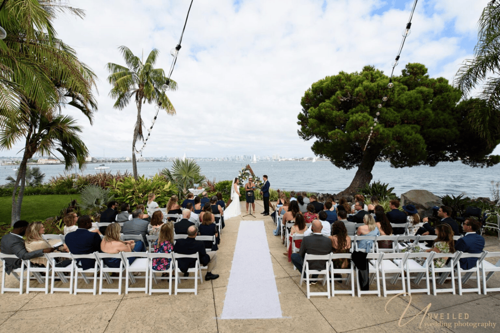 Outdoor waterfront wedding ceremony captured in full Wedding Photography Coverage.