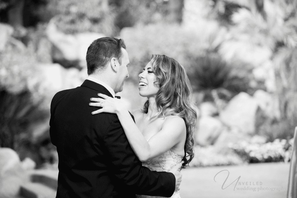 Black and white bride groom embrace by Grand Tradition Estate Wedding Photographer.